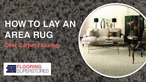 lay an area rug over carpet flooring