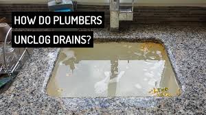 what do plumbers use to unclog drains