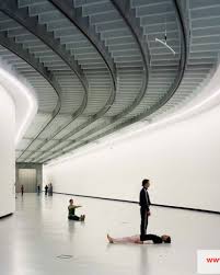 Museums' visitors admire everything they see as part of the art, such as walls, floors, and art pieces. Maxxi Museum Zaha Hadid Architects Bega Barrisol Normalu Sas Archello