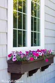 Vinyl flower boxes from hooks and lattice provide exceptional curb appeal and on a budget too. Window Boxes That Won T Fall Apart The Lilypad Cottage