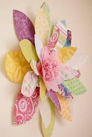 These beautiful paper flowers can do more than embellish your scrapbook pages. Scrapbook Paper Flower This One Is Attached To A Wall But You Could Use The Same Concept And Ad Scrapbook Paper Flowers Paper Flowers Diy Easy Paper Flowers