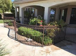 small backyards with iron fencing