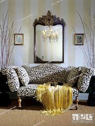 sofa with leopard print gilded mirror