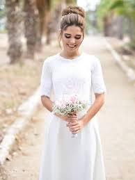 Wedding jumpsuits aren't as unusual as they once were, with more and more of those who love simple style turning to them for a quirky, comfortable. Beautiful Simple Modest Wedding Gown With Short Sleeves And High Neckline By Simple Wedding Dress With Sleeves Simple Wedding Dress Short Modest Wedding Gowns