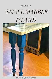 small kitchen island with a marble top