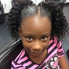 There are thin braids arranged in a square and a large bun is presented on the back of the scalp. 101 Angelic Hairstyles For Little Black Girls December 2020