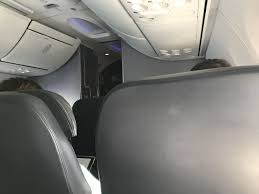 Fortunately there are power ports underneath the center console. Review Of United Flight From Newark To Miami In Domestic First