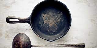 Is it safe to use a rusted cast iron pan for cooking?