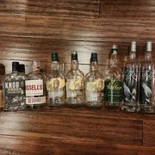empty whiskey bottles in des