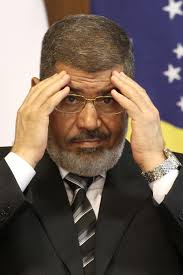 Deposed Egyptian leader Mohamed Morsi is due in court on charges of murder, days after he insisted he was the legitimate president at a separate hearing ... - morsi