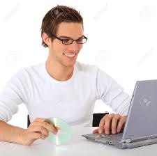 When ned say he wanted be 'the guy in the chair' and then the scene in the library on the computer this was all i could think of… Smiling Young Guy Using Notebook Computer All On White Background Stock Photo Picture And Royalty Free Image Image 9779897