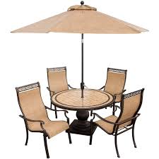 Size patio umbrellas come in a wide range of sizes—some cover just a single chair, while others are large enough to cover a table for four or more. Hanover Monaco 5 Piece Outdoor Dining Set With Umbrella Mon Dining Sets Modern Fabric Dining Chairs Round Patio Table