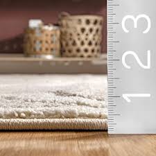 neutral indoor trellis area rug in the