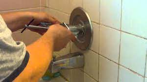 remove a stuck shower faucet handle