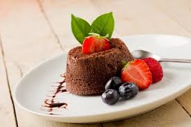 A beautiful serving of chocolate fondant with an ice cream ball, mint and a cup of coffee with marshmallow. 3 Fine Dining Dessert Recommendations At 3 Hualalai Resort Restaurants Luxury Big Island