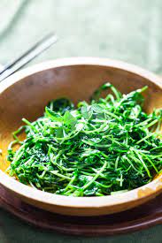 chinese stir fried pea shoots steamy