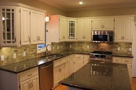 White kitchen cabinets marble countertops. Black Kitchen Granite Countertops With Tile Backsplash And White Cabinets Black Granite Countertops Granite Countertops Kitchen Dark Granite Countertops