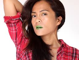 bright intensely green lipgloss grows