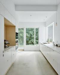kitchen white cabinets concrete floors
