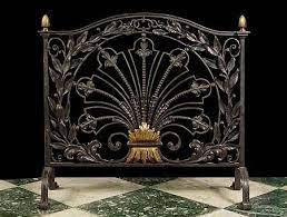 elaborate antique fireplace screen in