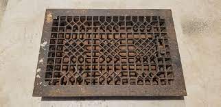 antique cast iron floor furnace grate