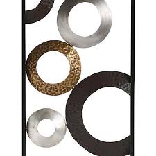 Made from metal with textured silver, gold, and brown plated circles and rings, this large statement piece is simple yet striking. Stratton Home Decor Stratton Home Decor Metallic Geometric Panel Wall Decor Shd0241 The Home Depot