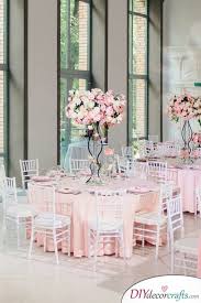 A grey and pink kitchen, pink bedroom accent walls, and even some highly unusual pink bathroom facilities all work together to make this one unique home a small white side table stands between the deep cushioned grey upholstered bed and the window. Wedding Table Decoration Ideas Simple Wedding Table Decorations