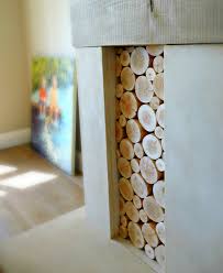 decorative logs stacked in an alcove of