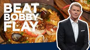 bobby flay makes seafood paella beat