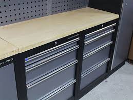 Folding stainless steel workbench with peg board (107). Magnum Garage Storage System With Workbench Kms Tools