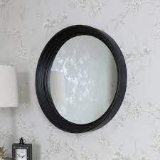 large round black wall mounted mirror