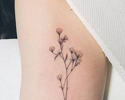 Small and delicate tattoos wildflower