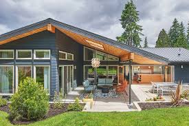 Proving that post and beam homes don't need to look like a traditional wooden home from the exterior, country cape is the ideal family home. Kirkland Mid Century Modern Seattle Architects Cta Design Builders