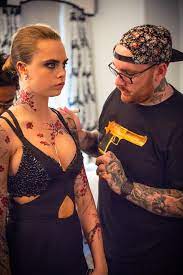How many tattoos does cara delevingne have and what do they mean? Cara Delevingne Met Gala Look Bang Bang Tattoo Vogue