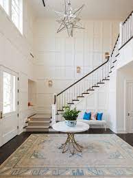 how to decorate a two story foyer