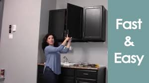 If the cabinet isn't plumb, slip shims between the cabinet and wall at the stud lines and adjust as necessary. Install Or Hang Wall Cabinets How To Renee Romeo Youtube