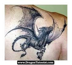 It is a very cute tattoo idea for women. Dragon Tattoo Western Dragon Tattoos Dragon Tattoo Dragon Tattoo Designs Dragon Tattoos For Men
