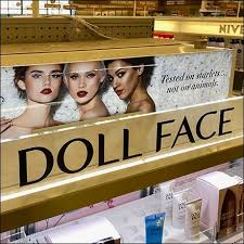 doll face cosmetics display endcap