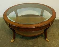 The most common round wood coffee table material is wood. Astounding Small Round Mahogany Coffee Table With Glass Top Brass Legs And Shelves Fo Dark Wood Coffee Table Modern Glass Coffee Table Round Glass Coffee Table