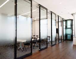 adds soundproof glass to movable walls