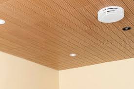 A dropped ceiling is a secondary ceiling, hung below the main (structural) ceiling. Wooden Suspended Ceiling Solo T Decoustics Tile Flame Retardant