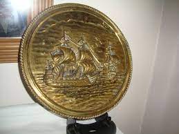 vintage brass wall plaque of sailing