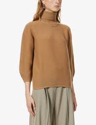 Khaite's turtleneck sweater is spun from mongolian cashmere that's chosen for its exceptional softness and has ribbed cuffs to create blouson sleeves. Camel Cashmere Turtleneck Sweaters Shop The World S Largest Collection Of Fashion Shopstyle