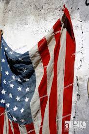 American Flag Hanging On Wall Outside