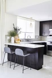 Who wouldn't love the bold attitude of these gray cabinets and red kitchen island? 21 Black Kitchen Cabinet Ideas Black Cabinetry And Cupboards