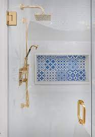 blue mosaic tiles in shower niche