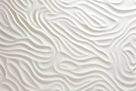 A White Textured Wall With A Pattern Of