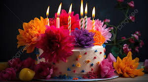 colorful flowers on a cake with candles