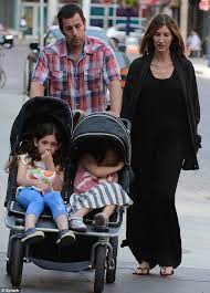 What hides beyond his fame? Adam Sandler And Wife Jackie Take Their Daughters Age Eight And Five Out In A Stroller Daily Mail Online
