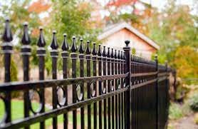 black wrought iron fence with spikes to